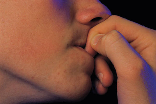 10 Terrifying Reasons to Stop Nail Biting—For Good!
